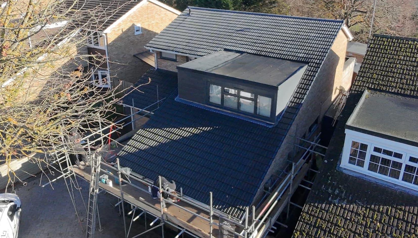 Full Re-Roof & Dormer Extension + Cladding